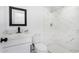 Clean bathroom with marble shower and vanity at 7213 W Osborn Rd, Phoenix, AZ 85033