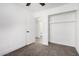 Bedroom with carpet,door and built-in shelving at 7213 W Osborn Rd, Phoenix, AZ 85033