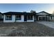 Modern single story home with dark gray roof and updated exterior at 7213 W Osborn Rd, Phoenix, AZ 85033