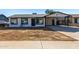 Newly renovated single story home with carport and front yard at 7213 W Osborn Rd, Phoenix, AZ 85033