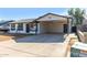 Newly renovated single story home with carport and front yard at 7213 W Osborn Rd, Phoenix, AZ 85033