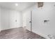 Laundry Room with Vinyl Flooring and Door at 7213 W Osborn Rd, Phoenix, AZ 85033