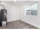 Laundry room with water heater and vinyl flooring at 7213 W Osborn Rd, Phoenix, AZ 85033