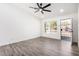 Bright living room with vinyl flooring and ceiling fan at 7213 W Osborn Rd, Phoenix, AZ 85033