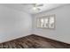 Bright bedroom with wood-look floors and plantation shutters at 740 W Tuckey Ln, Phoenix, AZ 85013