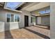 Covered entryway with brick pavers and modern door at 740 W Tuckey Ln, Phoenix, AZ 85013