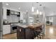 Sleek kitchen island with breakfast bar and pendant lighting at 740 W Tuckey Ln, Phoenix, AZ 85013