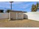 Tan colored storage shed in the backyard of the property at 740 W Tuckey Ln, Phoenix, AZ 85013