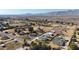 Aerial view of a house, pool, and expansive desert landscape at 7528 N 185Th Ave, Waddell, AZ 85355