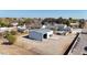 Aerial view of a large metal barn and surrounding property at 7528 N 185Th Ave, Waddell, AZ 85355