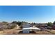 Aerial view of property with multiple barns and fenced pastures at 7528 N 185Th Ave, Waddell, AZ 85355