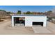 Large metal barn with double doors and boat storage at 7528 N 185Th Ave, Waddell, AZ 85355