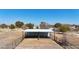 Two-stall metal barn with attached covered area at 7528 N 185Th Ave, Waddell, AZ 85355