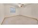 Simple bedroom with carpet flooring and a window at 7528 N 185Th Ave, Waddell, AZ 85355