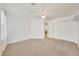 Bedroom with carpet, ceiling fan, and access to bathroom and closet at 7528 N 185Th Ave, Waddell, AZ 85355