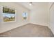 Cozy bedroom with carpet flooring and large windows at 7528 N 185Th Ave, Waddell, AZ 85355