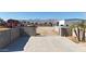 Driveway leading to a red barn and large metal building at 7528 N 185Th Ave, Waddell, AZ 85355