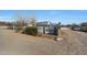 Gravel driveway leading to a home with a fenced pool area at 7528 N 185Th Ave, Waddell, AZ 85355