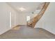 Entryway with a curved staircase and wood railing at 7528 N 185Th Ave, Waddell, AZ 85355