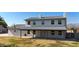 Two-story house with gray roof, white walls, and a covered porch at 7528 N 185Th Ave, Waddell, AZ 85355