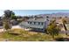 Two-story house with gray roof, white walls, and a covered porch at 7528 N 185Th Ave, Waddell, AZ 85355