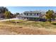 Two-story house with gray roof, white walls, and a covered porch at 7528 N 185Th Ave, Waddell, AZ 85355