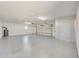 Clean garage with painted floor and overhead door at 7528 N 185Th Ave, Waddell, AZ 85355