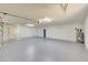 Bright garage featuring painted floor and additional storage at 7528 N 185Th Ave, Waddell, AZ 85355