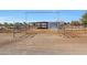 Metal horse stable with covered stalls and open sides at 7528 N 185Th Ave, Waddell, AZ 85355