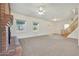 Living room with staircase and large windows at 7528 N 185Th Ave, Waddell, AZ 85355