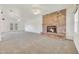 Bright living room featuring a brick fireplace at 7528 N 185Th Ave, Waddell, AZ 85355