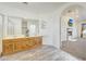 Main bathroom with double vanity and view of bedroom at 7528 N 185Th Ave, Waddell, AZ 85355