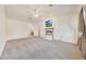 Main bedroom with fireplace, carpet, and access to bathroom at 7528 N 185Th Ave, Waddell, AZ 85355