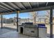 Stainless steel outdoor kitchen with covered patio at 7528 N 185Th Ave, Waddell, AZ 85355