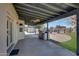 Covered patio with built-in grill and pool view at 7528 N 185Th Ave, Waddell, AZ 85355