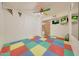 Playroom with foam floor mats and mounted TV at 7528 N 185Th Ave, Waddell, AZ 85355