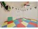 Playroom with colorful foam floor mats and ceiling fan at 7528 N 185Th Ave, Waddell, AZ 85355