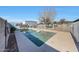 Inviting kidney-shaped pool with a slide and large backyard at 7528 N 185Th Ave, Waddell, AZ 85355