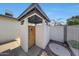 Private outdoor shower with wooden gate next to the pool area at 7528 N 185Th Ave, Waddell, AZ 85355