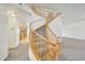 Elegant curved staircase with wood railings at 7528 N 185Th Ave, Waddell, AZ 85355