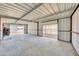 Open concept storage area with double garage doors at 7528 N 185Th Ave, Waddell, AZ 85355