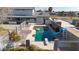 Inviting swimming pool with a slide and diving board in a fenced backyard at 7528 N 185Th Ave, Waddell, AZ 85355