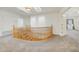 Upstairs hallway with wood railing and access to bedrooms at 7528 N 185Th Ave, Waddell, AZ 85355