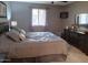 Spacious bedroom with a queen-size bed and neutral color scheme at 8020 E Keats Ave # 269, Mesa, AZ 85209