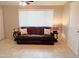 Living room with brown corduroy couch and end tables at 8020 E Keats Ave # 269, Mesa, AZ 85209