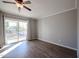 Bedroom with balcony access and wood-look floors at 8225 N Central Ave # 46, Phoenix, AZ 85020