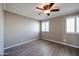 Bright bedroom with wood-look floors and plantation shutters at 8225 N Central Ave # 46, Phoenix, AZ 85020