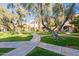 Landscaped courtyard with walking paths and mature trees at 8225 N Central Ave # 46, Phoenix, AZ 85020