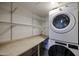 Laundry area with washer, dryer, and shelving at 8225 N Central Ave # 46, Phoenix, AZ 85020