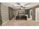 Spacious bedroom with a dark brown bed frame and patterned wallpaper at 875 S Brewer Dr, Gilbert, AZ 85296